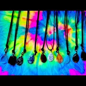 11 Crystal necklaces on leather cords